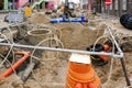 Underground pipe replacement on city street, site dewatering system, new pipeline with gate valves Royalty Free Stock Photo