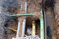 Underground services, including telecom, gas, electricity fibre optic ducts, exposed for repair during groundworks and new road