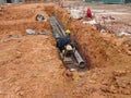 Underground sewerage pipe installed by construction workers at the construction site. Royalty Free Stock Photo