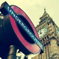 Underground sign and the Big Ben in London, United Kingdom, with