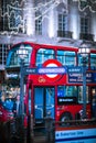 Underground sign and double decker. Festive decorations and Christmas lights at Piccadilly Circus. Royalty Free Stock Photo