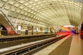 Underground Station with a Departing Train Royalty Free Stock Photo