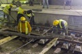 Underground subway tunnel workers pouring concrete