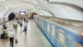 An underground train departing from Plosha Povstannya metro station on Oleksievska Line of Kharkiv metro Royalty Free Stock Photo