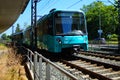 An underground train enters Frankfurt-Heddernheim station.