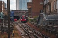 Underground tube train on railroad tracks in London city