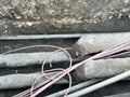 Underground utility installation with exposed cables in construction zone Royalty Free Stock Photo