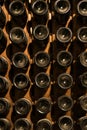 Underground wine cellar, bottles storage, bottles stacked on racks, bottle bottom Royalty Free Stock Photo