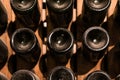 Underground wine cellar, bottles storage, bottles stacked on racks, bottle bottom Royalty Free Stock Photo