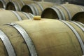 Underground wine cellar with rows of wooden barrels 2 Royalty Free Stock Photo