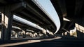 Underneath a complex network of concrete overpasses on a sunny day Royalty Free Stock Photo