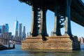 Base of the Manhattan Bridge along the East River with the Lower Manhattan Skyline in New York City Royalty Free Stock Photo