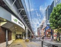 Underpass with metal pillar and blue entrance gate of Shopping street of the west exit of Kanda Station on the Yamanote Line. The