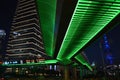 Underside of a bride lit by neon green lights in Shanghai, China at night