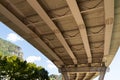 Underside of Bridge with Mountain and Trees Royalty Free Stock Photo