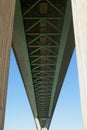 Underside of a long bridge. Royalty Free Stock Photo