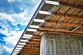 Underside of old road bridge during renovation with timber planks supporting structure Royalty Free Stock Photo