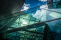 Underside panoramic and perspective view to steel blue glass high rise building with reflections Royalty Free Stock Photo