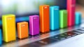 Understanding business growth data analysis using color coded bar graph on laptop keyboard for insights Royalty Free Stock Photo