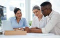 Understanding new business objectives as a team. Shot of a group of businesspeople working together in an office. Royalty Free Stock Photo