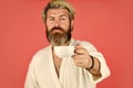 Understanding Your Daily Rhythms. Man with beard in bathrobe enjoy morning coffee. Guy in domestic clothes hold coffee