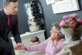 Undertaker comforting elderly woman