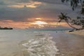 undertow of the sea at the beach with tropical sunset