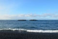 Undertow with Waves Pulling Back Off Black Sand Beach Royalty Free Stock Photo