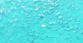 Underwater air bubbles in blue water pouring Royalty Free Stock Photo