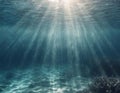 Underwater background with light rays shining the deep water Royalty Free Stock Photo