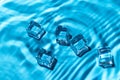 Underwater background with many ice cubes. blue abstract surface with sunlight through water and copy space. concept of travel and Royalty Free Stock Photo