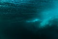 Underwater barrel wave in clear ocean in Oahu. Water texture