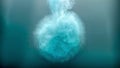 Underwater blast with blue and white tiny bubbles against a blurred background with a soft ethereal light illuminating top Royalty Free Stock Photo