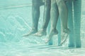 Underwater couple legs in swimming pool Royalty Free Stock Photo