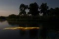 Underwater diving at night with flashlight. Light from river bottom. Full moon over foggy river in Volyn. Moon light at night land Royalty Free Stock Photo