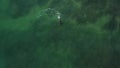 Underwater hunting Aerial view scuba diver spearfishing in shallow ocean water
