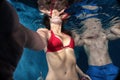 Underwater images of man and woman bodies