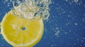 Underwater lemon slice in soda water or lemonade with bubbles