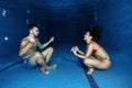 Underwater meditation, couple in the swimming pool Royalty Free Stock Photo