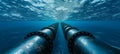 Underwater metal conduit for subsea oil and gas pipeline transport in blue ocean Royalty Free Stock Photo