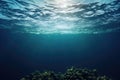 Underwater ocean. Sun rays shining through the water surface. Blue and teal transparent water. Royalty Free Stock Photo