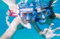 Underwater photo of a couple snorkeling in ocean Royalty Free Stock Photo