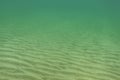 Underwater photo - almost flat sea bottom, only small sand Royalty Free Stock Photo