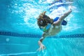 Underwater photo of a Young Boy swimmer in the Swimming Pool with Goggles Royalty Free Stock Photo