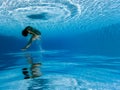 Underwater photograph : Woman jumping in pool