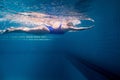 underwater picture of young female swimmer exercising Royalty Free Stock Photo