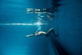 underwater picture of young swimmer in goggles exercising Royalty Free Stock Photo