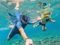 Underwater portrait of father and son snorkeling together Royalty Free Stock Photo