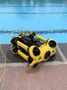 Underwater ROV camera drone next to swimming pool