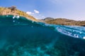 Underwater scene with clear ocean water and mountains